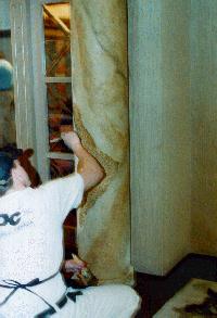 SPC worker faux finishing marble column at Clarion Hotel